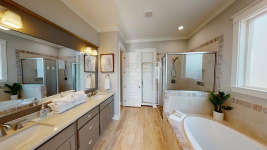 Luxury en suite master bathroom with walk-in shower and tub