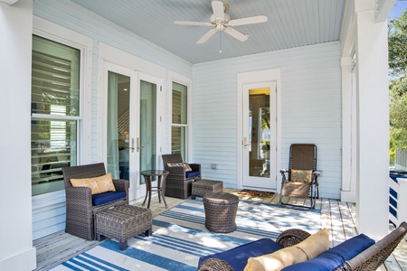 Covered porch overlooks community pool