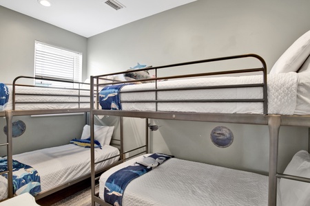 Bedroom 8 features 2 sets of Twin bunk beds and a TV