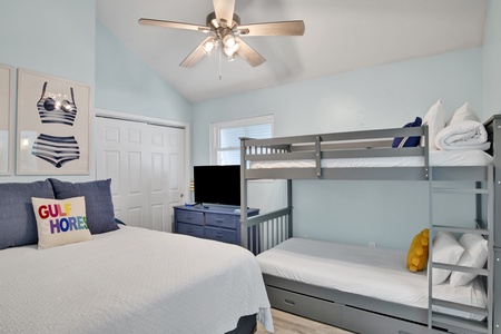 Hello Waves (unit B) 2nd floor bedroom sleeps 4 in a queen bed and a twin bunk with TV and private bathroom