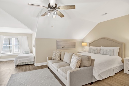 This guest bedroom offers a King bed and 2 Twin single beds