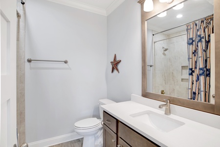 The bunk room has a private bath with a tub/shower combo