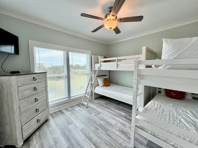 Bedroom 4 has a TV and two sets of Twin bunk beds, sleeps 4