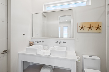 There is also a double vanity in the bathroom in Bedroom 3