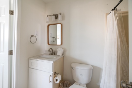 Full bathroom on the 1st floor with a tub/shower combo