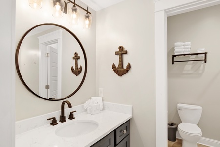 Bath shared between bedroom 3 and 4, double sinks, vanities and shower-tub combo