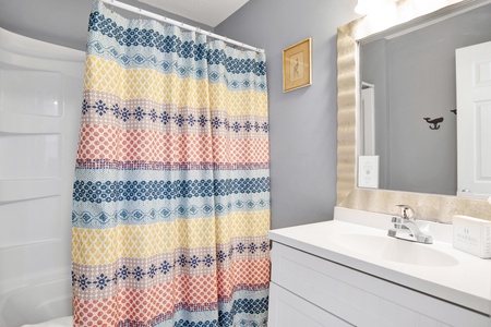 The two guest bedrooms share the bathroom in the hallway