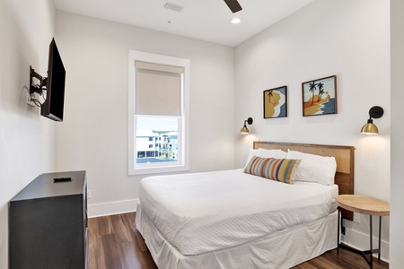 Bedroom #3 is on the 2nd floor with a queen bed, TV and private bathroom