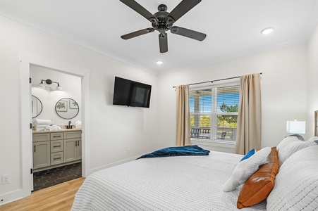 Bedroom 1 has a TV, ceiling fan and a private bathroom