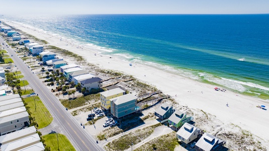 Expansive beach in front and covered parking in the back