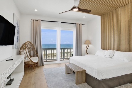 The master bedroom offers a King bed, private balcony access and a private bathroom
