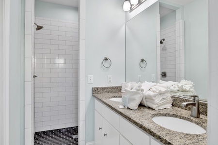 Private master bath with a double vanity and a walk-in shower