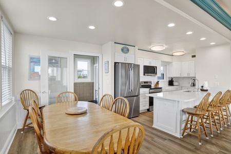 Open dining room with plenty of seating at the table and bar