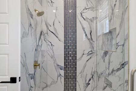 Featuring a walk-in, tile shower