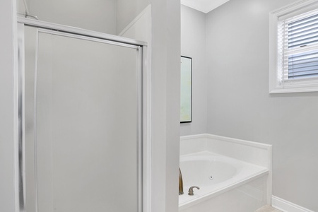 1st floor Master bath has a soaking tub and a walk-in shower