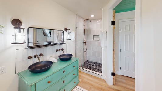 The private Master bath has double sinks and a walk-in shower