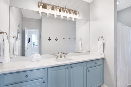 Private bath in Bedroom 2 with a tub/shower combo