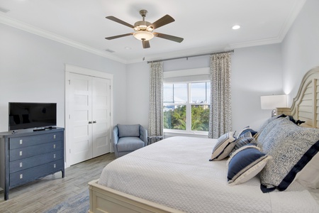 Bedroom 3 with a ceiling fan, TV and private bathroom