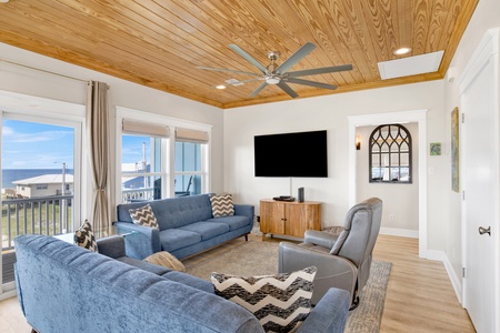 Large mounted TV and ceiling fan