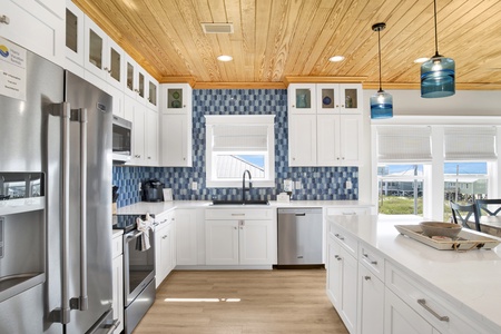 Fully equipped kitchen with stainless steel appliances and granite counters