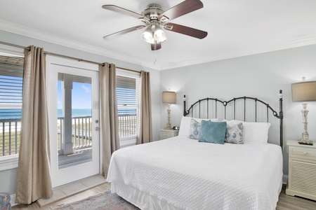 This guest bedroom offers balcony access and a private bathroom