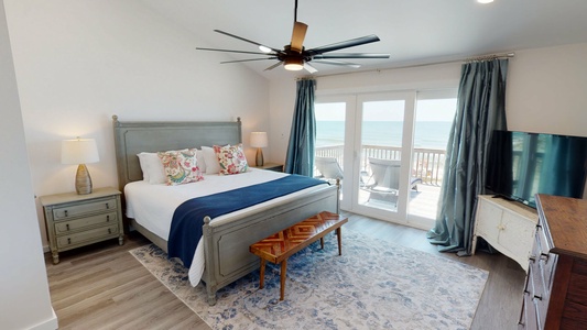Upstairs on the upper level is bedroom #3 with a king bed and balcony access