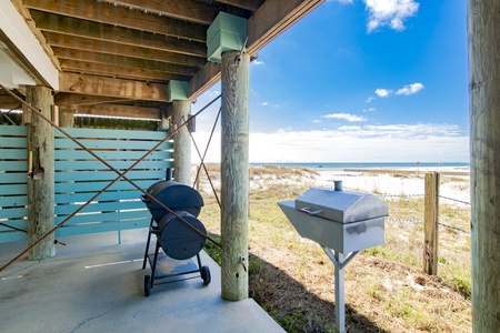 2 charcoal grills under the home