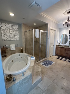 Master bath with a walk-in shower and jacuzzi tub