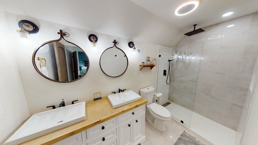 Master bedroom with double vanity and walk-in shower