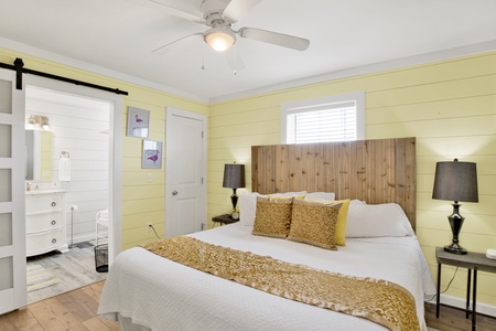 The master bedroom offers a King bed, TV and private bathroom