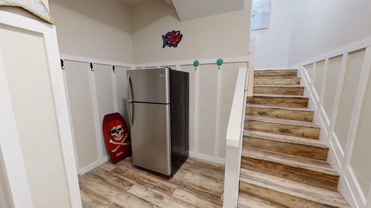 Extra refrigerator in mudroom entrance on ground floor