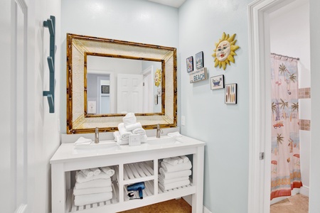 The shared hall bathroom features a tub/shower combo