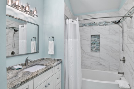 The master bath has a tub/shower combo