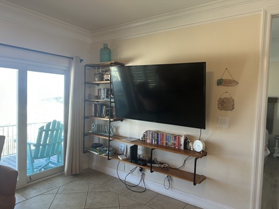 Living room with TV and balcony access