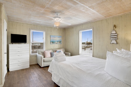 Bedroom 3 has a TV, ceiling fan, and an attached half bath