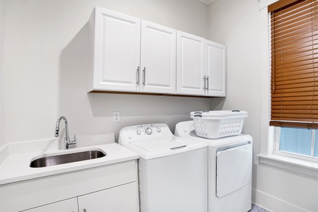 1st floor full size laundry room with laundry sink