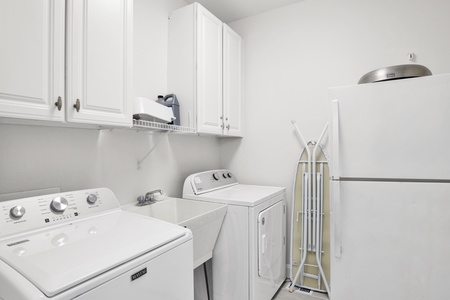 1st floor laundry room with a 2nd fridge and laundry sink