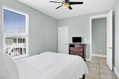 Bedroom 4 comes with a television and a ceiling fan