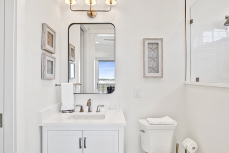 The private bathroom has a single vanity and closet