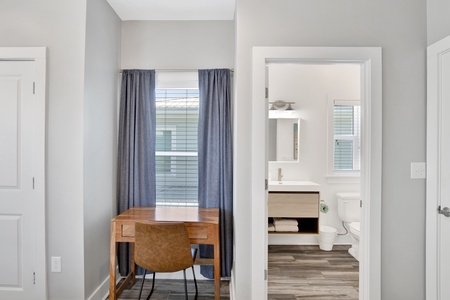 Bedroom 2 offers a desk and private bathroom
