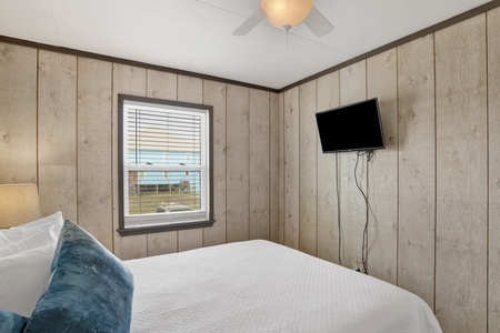 The guest bedroom offers a TV and Queen bed, sleeps 2