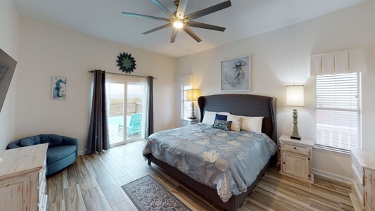 Bedroom #3 features a king bed, Gulf views, ceiling fan and access to the deck