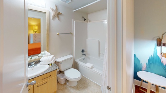 The attached bath to Bedroom 3 has a tub shower combo and a hall entrance
