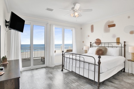 2nd floor Bedroom 3 with a king bed, Gulf views, balcony access and a TV