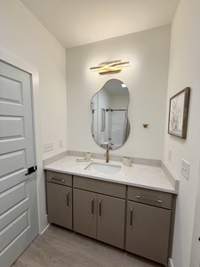 The Jack and Jill bathroom has a single vanity