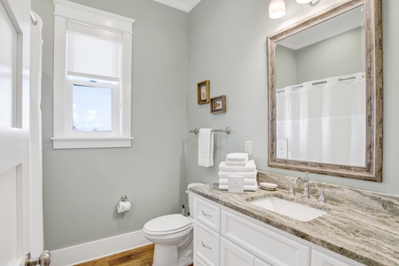 The shared hallway bathroom features a tub/shower combo