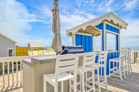 Covered poolside bar with sink