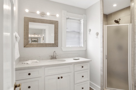 The private master bath has a walk-in shower