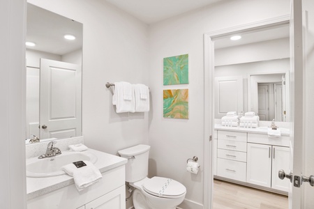 The full size bathroom has a tub/shower combo with a hall entrance and entrance from the main bedroom