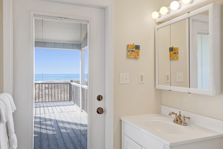 The private Master bath has deck access